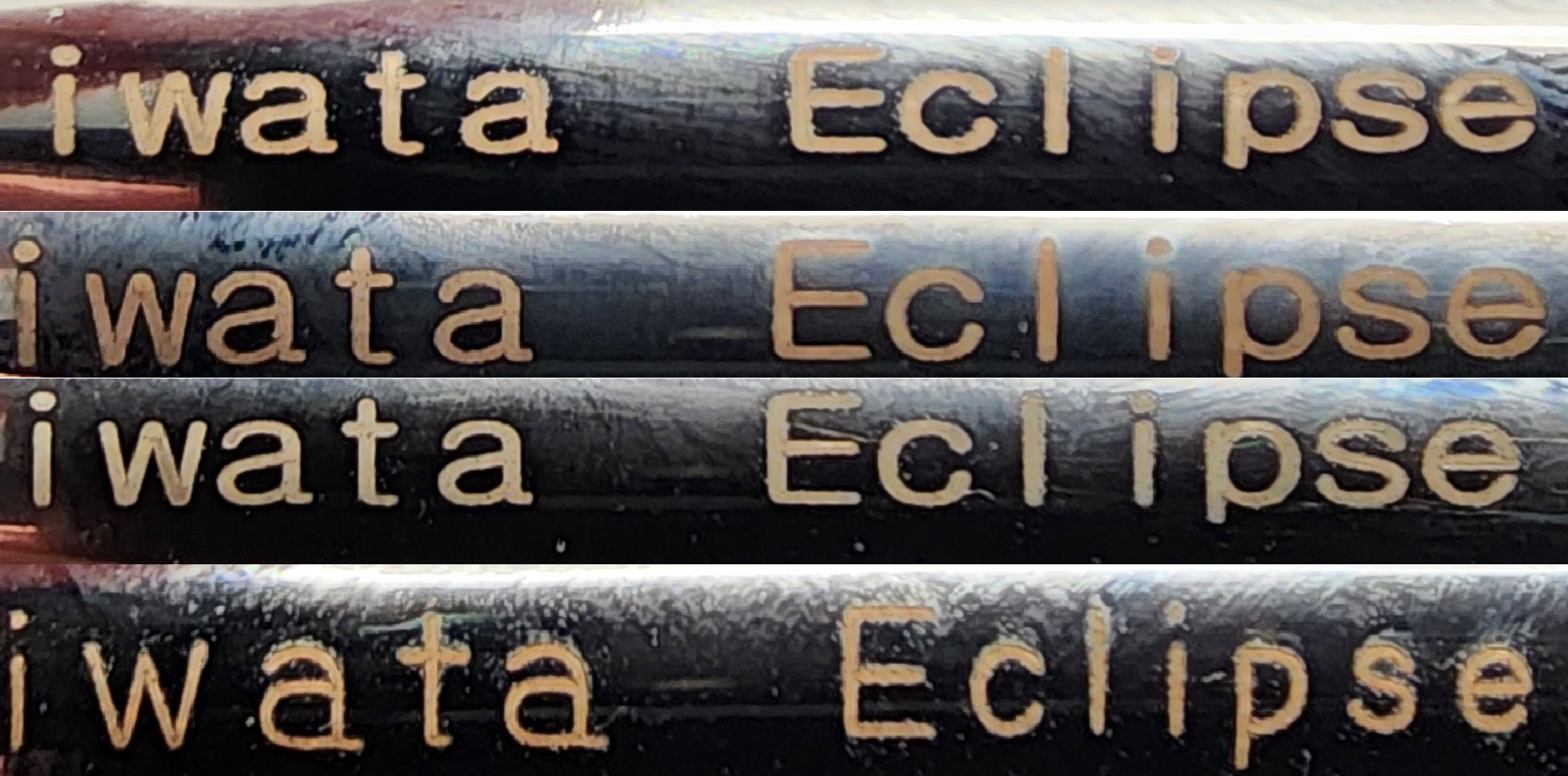 Closeup of 4 different faint, dull, non uniform engravings that read Iwata Eclipse on the side of counterfeit airbrushes