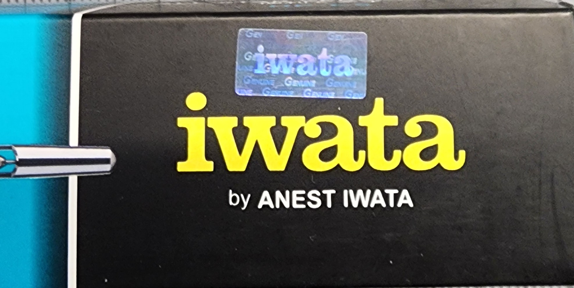 Eclipse cs box panel showing counterfeit iwata hologram applied above iwata logo